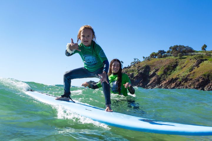 a man riding a wave on a surfboard in the water